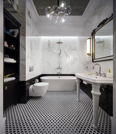 a bathroom with black and white tile flooring