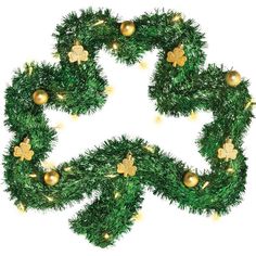 a christmas wreath with ornaments hanging from it's sides and gold balls on the top