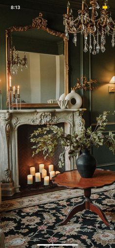 a living room filled with furniture and a fire place next to a fireplace covered in candles