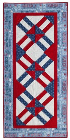 a red, white and blue quilted wall hanging