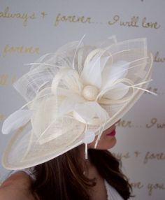 Soak up the sun in the chicest, vintage-styled sun hat. This hat has a slightly flipped brim silhouette, large mesh petals that make a statement not to be messed with and topped off with a delicate feather flower. This glam style features day-to-dark versatility for the perfect derby queen look!Looking for fascinators to choose from, shop Here:http://www.etsy.com/shop/EyeHeartMe?section_id=12490116Add a matching shawl or scarf, shop Here:http://www.etsy.com/shop/EyeHeartMe?section_id=12527888Mos Unique Fascinators, Mesh Flowers, Flowers And Feathers, Feather Extensions, Scarf Shop, Kentucky Derby Hats, Feather Flower, Mesh Hat, Glam Style