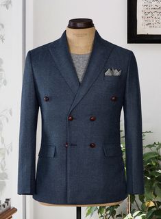 A classic go-to for any professional wardrobe, our Blue Herringbone Jacket with a natural, timeless finish is bound to impress for any occasion. Crafted from wool, the jacket is expertly designed in a herringbone weave that adds a touch of dimension to formal wear with its visible texture and lines, ideal for all formal events.  
Look Includes   Showman Blue Herringbone Tweed Fabric  Double Breasted Jacket Style  Peak Lapel  (3-3.2")    Vintage Brown Leather  Buttons  Double Vent  Two Working Cu Herringbone Tweed Jacket, Herringbone Jacket, Herringbone Tweed, Professional Wardrobe, Peak Lapel, Double Breasted Jacket, Tweed Fabric, Vintage Brown, Tweed Jacket