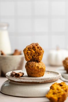 two pumpkin muffins stacked on top of each other