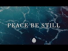 the words peace be still are displayed on a blue and black marble background with an image of