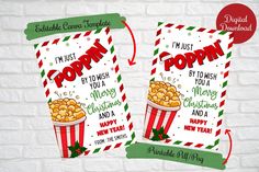 two christmas movie tickets with popcorn on them