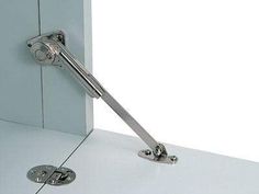 an image of a door handle that is on the side of a cabinet with it's latch open