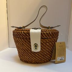 Reminiscent Of Summer Holidays And 1950s Movies, Our Handmade Woven Natural Basket Bag Features White Leather Trim. A Perfect Accompaniment To Breezy Summer Looks, This Lovely Vintage Bag Has A Texture And Patina That Are Hard To Resist Adding A Bohemian Flair To Casual Looks And A Chic Edge To Your Warm Weather Wardrobe. Details Leather Trim Accents Interior: Zip Pocket, Two Slip Pockets, Fully Lined In Faux Suede White Straw Bag With Top Carry Handle, White Straw Bag With Top Handle, Summer White Bucket Bag With Top Carry Handle, White Bucket Bag With Top Carry Handle For Summer, White Summer Bucket Bag With Top Handle, White Top Handle Bucket Bag For Summer, White Straw Shopping Bag With Top Handle, White Straw Bag With Detachable Handle, White Straw Bag With Detachable Handle And Top Handle