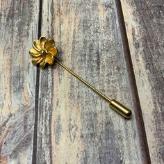 A cute little gold tone stick pin flower brooch. Vintage style in good used condition.  Size  2 1/4 by 5/8 inches See my shop for more vintage and handmade items. Gold Flower Lapel Pin For Formal Occasions, Gold Flower Brooch Lapel Pin, Gold Flower Brooch Pins, Gold Flower Lapel Pin, Pin Wheel, Strung Beads, Brooch Vintage, Stick Pins, Keep Jewelry