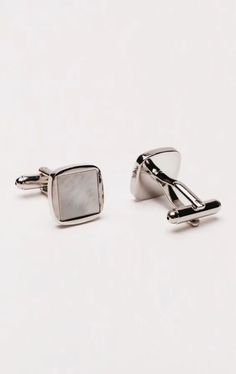 Embrace the epitome of luxury with the Dobell Cufflinks featuring a Square Mother of Pearl Inset. These cufflinks are a perfect blend of classic elegance and contemporary style, designed to add a sophisticated touch to your formal ensemble. The square design and the silver-tone setting frames the mother of pearl perfectly, enhancing its natural beauty while providing a polished finish. Wing Collar Shirt, Black Tie Tuxedo, Boys Waistcoat, Tweed Wedding, Tweed Overcoat, Wedding Waistcoats, Harris Tweed Jacket, Burgundy Tuxedo, Tuxedo Shoes