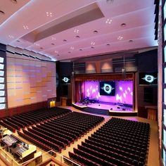 an empty auditorium filled with lots of seats