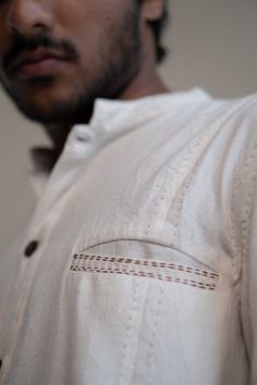 This Dawning Panelled Long Shirt comes in a calm and soothing color. This Kala Cotton shirt is undyed and unbleached. It has a band collar and full front panelling. This full-sleeve shirt comes with two patch pockets that are extensively adorned with stitches of Kantha, a form of Indian hand embroidery. *This item is a final sale and not eligible for returns or exchanges. *This item can take up to 14 business days to ship as it is made to order for you. Traditional Long Sleeve Linen Tops, Casual Long Sleeve Beige Kurta, Beige Long Sleeve Casual Kurta, Casual Beige Long Sleeve Kurta, Traditional Long Sleeve Linen Shirt, Traditional Cream Long Sleeve Top, Long Sleeve Off White Kurta For Summer, Traditional Long Sleeve Cream Top, Off White Long Sleeve Cotton Kurta