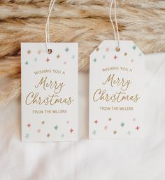 two tags with merry christmas written on them