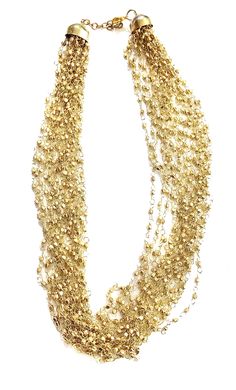 "Layered GOLD Beaded necklace perfect for the upcoming holiday parties ** Multi strand fine beaded Necklace ** hand beaded jewelry ** Length of Necklace is 18 inches ** Perfect on a Little Black Dress or even a T-shirt. ** Make a statement this thanksgiving or be the spice of the Christmas party. This beautiful necklace would make a great Holiday Gift for someone special. All Items come carefully gift wrapped in branded boxes or bags. A complimentary message can be included on request. PRESS: \" Beaded Layered Necklace For Party With Round Beads, Beaded Layered Necklace With Round Beads For Party, Beaded Layered Necklace For Party, Party Layered Necklace With Beaded Chain, Gold Jewelry For Holiday Party, Holiday Party Gold Jewelry, Multi-strand Gold Jewelry For Celebration, Party Long Beaded Chain Necklaces, Party Jewelry In Gold-tone With Gold Beads