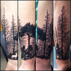 this is an image of a man's arm with trees in the woods on it