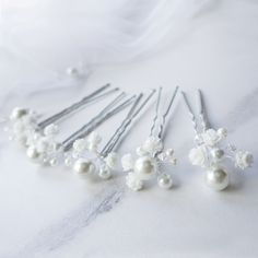 Wedding hair piece with babys breath hair flowers and pearl hair pins are compliment many different styles. These tiny flower hair pins with real touch flowers look amazing in any hair style. With this pearl wedding headpiece be sure your hair will be gorgeous Floral bridal hair piece is the perfect touch for your wedding day, or special occasion (bridesmaid hair pin, wedding hair pins, pearl hair clip, decorative hair pins).  Check out a 15 sec video of these bridal hair pins Please note, flowe Decorative Hair Pins, Pearl Headpiece Wedding, Bridesmaid Hair Pins, Floral Hair Pins, Wedding Hair Piece, Hair Flowers, Real Touch Flowers, Pearl Hair Pins, Pearl Hair Clip