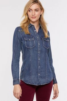 A classic denim shirt with a hint of western flair—that's the Aubrey, featuring whipstitching detail along its edges. Made of a comfortable blend of cotton, Tencel, and linen that's been indigo enzyme washed for softness, this snap-front denim shirt is lightweight and versatile, making it an effortless pick for cool fall nights by the fire pit with friends. Genuine abalone shell snaps with antique nickel rims add a beautiful finishing touch. Dark Wash Button-up Tops For Rodeo, Dark Wash Tops For Fall Rodeo, Western Style Denim Blue Denim Top, Dark Wash Denim Tops For Rodeo, Western Denim Blue Denim Tops, Fall Rodeo Denim Shirt, Distressed Dark Wash Button-up Denim Top, Distressed Dark Wash Denim Button-up Top, Classic Washed Denim Top For Fall