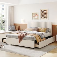 a white bed sitting next to a window in a bedroom on top of a hard wood floor