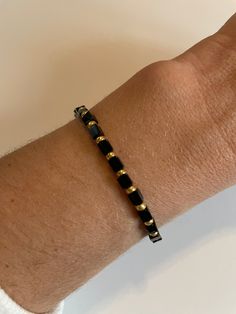 Black cube bead with seed bead color of your choice Cheap Beaded Bracelets With Gold And Black Beads, Minimalist Adjustable Black Beaded Bracelets, Everyday Beaded Bracelets With Spacer Beads, Minimalist Beaded Stretch Bracelet For Gift, Black Stretch Bracelet With Tiny Beads As Gift, Minimalist Black Beaded Bracelets For Everyday, Minimalist Beaded Stretch Bracelet, Adjustable Heishi Beads Bracelet With Faceted Beads, Adjustable Black Heishi Beads Bracelets