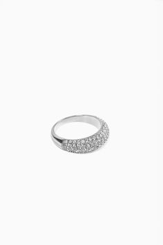 Boasting an eye-catching dome design, our signauture Layla ring in pavé is embellished with radiant simulated diamond stones that glimmer beautifully in the light. Its luxurious appearance and modern flair make it an exceptional choice to elevate any jewelry collection.- Stainless steel base - Simulated diamond accents- Width: 0.2" / 5mm x 0.1" / 2.5mm - Available in sizes 6, 7, 8 - Available in gold + silver - Engraved with signature MC branding- Hypoallergenic, non-tarnish, water-resistant Stacker Rings, Zodiac Pendant, Pave Ring, Timeless Art, Diamond Stone, Cocktail Rings, Ring Necklace, Silver Color, Necklaces Bracelets