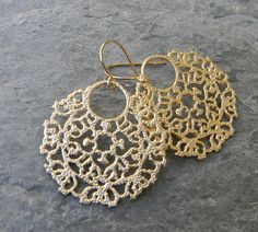 These earrings are the perfect everyday earrings. They measure approximately 2 1/4 inches form the top of the earwire. The gold pendant is 1 1/2 inch wide and has an ethnic, bohemian feel. They hang from 14 karat gold plated earwires. Earrings come with safety nuts and are individually gift boxed. I ship USPS first class mail Monday through Friday. Please visit my shop here : http://www.etsy.com/shop/Greenperidot?ref=si_shop Artisan Gold Dangle Hoop Earrings, Bohemian Gold Hoop Earrings With Ear Wire, Gold Bohemian Hoop Earrings With Ear Wire, Gold Filigree Bohemian Chandelier Earrings, Gold Bohemian Filigree Chandelier Earrings, Flower Girl Jewelry, Knit Jewelry, Boho Aesthetic, Earrings Inspiration