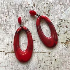 Cherry red & black marbled acrylic oval donut drops meet marbled coral lucite studs. The Joanna earrings are so light-weight but they're a great noticeable size. One of the few styles in the collection that uses contemporary parts, we make these here in the US with surgical steel posts. These are a great bold size, measuring just over 2.25" in length from end to end. Leetie Lovendale jewelry is made with 95% vintage lucite parts that were originally made in the US in the 1960's - early 80's. Surgical Steel Earrings, Vintage Lucite, Cherry Red, The Collection, Post Earrings, Statement Earrings, Cherry, Marble, Black And Red