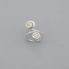 925 Sterling Silver Shiva Eye Ring with Spiral Design Silver jewelry CODE: SER19 Material: 925 Sterling Silver Gem Stone: SHIVA EYE Weight: 1.89 Gram Top Size : 10mm Ring Size: 6,7,8,9 Finishing: silver Price : Per Pcs Handmade Sterling Silver Ring with a polished natural shiva eye shell. Shiva Eye Shell is a considered a good luck and positive energy Stone. This shell is the a perfect present for all those women who loves the natural beauty. This beautiful round shiva eye ring would be a perfec Spiral Sterling Silver Jewelry For Anniversary, Spiral Nickel-free Jewelry For Anniversary, Adjustable White Spiral Jewelry, White Adjustable Spiral Jewelry, Silver Spiral Wire Wrapped Rings, Handmade Sterling Silver Spiral Rings, White Spiral Jewelry For Anniversary, White Gold Spiral Rings For Gifts, Spiral Sterling Silver Ring Stamped 925