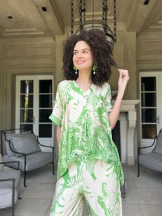 Elevate your wardrobe with the Makayla Jungle Print Top. Crafted from a luxurious blend of 80% viscose and 20% silk, it offers a silky-smooth feel and airy comfort. Versatile enough to be worn separately or paired with matching pants, it's perfect for loungewear or resort chic. The vibrant jungle print adds a touch of exotic flair, while its one-size-fits-all design comfortably accommodates sizes from small to large. Experience comfort and style in one effortlessly chic top. -One size-fits a Sma Resort Chic, Jungle Print, Chic Top, Matching Pants, Print Top, Print Tops, Printed Shorts, Short Sleeves Tops, Lounge Wear