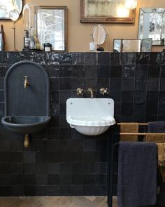 a bathroom with two sinks and mirrors on the wall