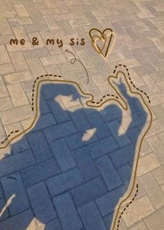 the shadow of a person standing next to a street sign