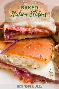 two sandwiches stacked on top of each other with the words baked italian sliders above them