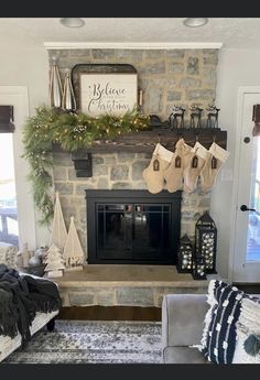 a living room with a fireplace decorated for christmas