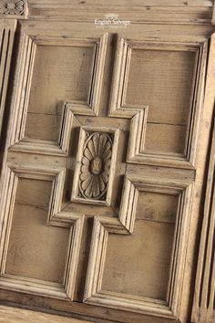 an old wooden door with carvings on it