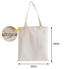 a white canvas bag with measurements for the handles and sides, on a white background