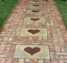 a brick path with hearts painted on it