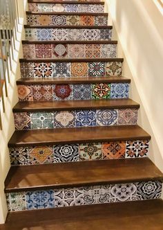 the stairs are decorated with colorful tiles