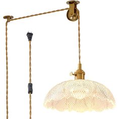 an old fashioned lamp hanging from the ceiling with two cords attached to it and one light on