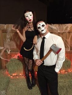 a man and woman dressed up in halloween costumes