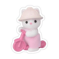 a small white cat with a pink bike on it's back and wearing a hat