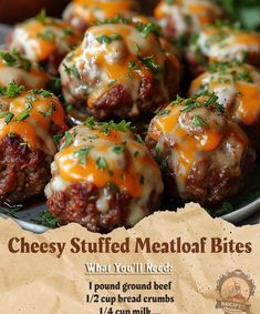 cheese stuffed meatballs are on a plate