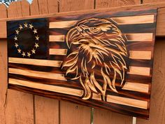 an american flag made out of wood with an eagle on it