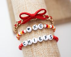 Game Day bracelets! Your choice between one, two, or all three! - - SIZING - - Every piece is made just for you! Our standard size fits a 6 inch wrist (measures 6.5 inches total length), but can be adjusted upon request. Please leave your desired size in the 'Notes' section upon checkout. Football Jewelry Diy, Chiefs Bracelet Ideas, Chiefs Friendship Bracelet, Chiefs Bracelet, Chiefs Game Day, Chiefs Crafts, Kansas City Chiefs Craft