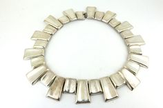 This is Vintage Taxco Heavy Link Necklace 925 Sterling Silver NC 1821 Condition: Vintage Metal: Sterling .925 Silver Weight: 147 grams Diameter: 5.5 in Images you see are actual pictures of jewelry you will receive Every purchase comes thoughtfully packaged and ships within 1 business day New York State buyer will be charged sales tax Feel free to contact us with any questions. We are open Mon-Fri 9-5 EST We appreciate your business Modernist Engraved Silver Jewelry, Contemporary Jewelry With Shiny Finish As Gift, Contemporary Jewelry With Shiny Finish For Gift, Modern Formal Jewelry Stamped 925, Silver Modernist Necklaces For Formal Occasions, Silver Modernist Necklace For Formal Occasions, Modernist Silver Necklace For Formal Occasions, Modernist Silver Jewelry With Polished Finish, Silver Modernist Jewelry With Polished Finish