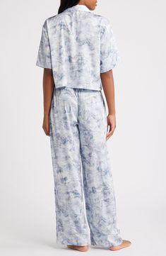 You won't be in any hurry to get dressed in the morning when you're in these relaxed-fit satin PJs featuring a boxy, button-up crop top and matching pants. Top has front-button closure; notched collar; elbow-length sleeves; chest patch pocket Bottoms have elastic waist; side-seam pockets 97% polyester, 3% spandex Machine wash, tumble dry Imported Satin Pjs, Satin Pajamas, Matching Pants, Notched Collar, Elbow Length Sleeve, Pajamas Women, Get Dressed, In The Morning, The Morning