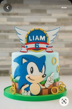 a sonic birthday cake with the name i am on top and an image of a hedgehog