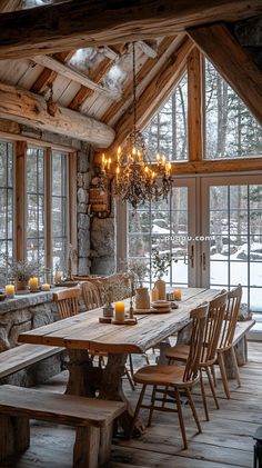 a rustic dining room with wooden tables and chairs, chandelier hanging from the ceiling