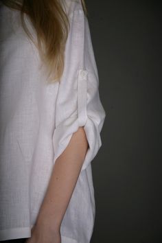 "That very comfy and airy style shirt. Very loose simple shirt with 4 buttons closure at front, oval form neck and long sleeves - with the strap inside - for keeping folded sleeve cuff and closed with button. You will feel very free and comfortable in this eco friendly shirt , which you can wear in every day, go for holiday, garden... As always this shirt is available in my shop - in both eco colors - natural not dyed linen and white. This shirt I propose in three sizes - S, M and L. Size S bust White Tops With Roll-up Sleeves For Everyday, Everyday White Tops With Roll-up Sleeves, Casual Everyday Blouse With Cuffed Sleeves, White Shirt With Cuffed Sleeves For Summer, Casual Blouse With Cuffed Sleeves For Everyday, Summer White Shirt With Cuffed Sleeves, White Summer Tops With Cuffed Sleeves, Casual White Shirt With Cuffed Sleeves, Minimalist Relaxed Fit Summer Shirt