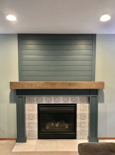 an empty living room with a fireplace in it