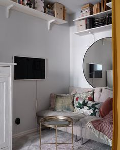 a living room filled with furniture and a flat screen tv