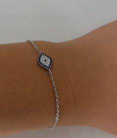 "This handmade  bracelet features a 5x10mm high quality zircons. . The Bracelet length is 6\" long and 1\" adjustable extender for a total of 7 \". This Bracelet is made in Greece. Whatever the reason may be, these beautiful Bracelet is perfect for every occasion. This Greek Bracelet is the PERFECT GIFT for every Woman. So delicate and feminine. This Bracelet looks gorgeous with any everyday outfit or special occasion wear. This captivating Bracelet feature elegantly sculpted Gemstones. Perfect Adjustable Sterling Silver Tennis Bracelet As Gift, Silver Hand Set Chain Bracelet As Gift, White Sterling Silver Tennis Bracelet As Gift, Sterling Silver Evil Eye Bracelet With Adjustable Chain, Silver Evil Eye Bracelet Gift, Hand Set Sterling Silver Bracelet As Gift, Silver Cubic Zirconia Evil Eye Bracelet Gift, Sterling Silver White Gold Crystal Bracelet Gift, White Sterling Silver Hand Set Bracelets