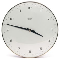 a white clock with black hands on a white background